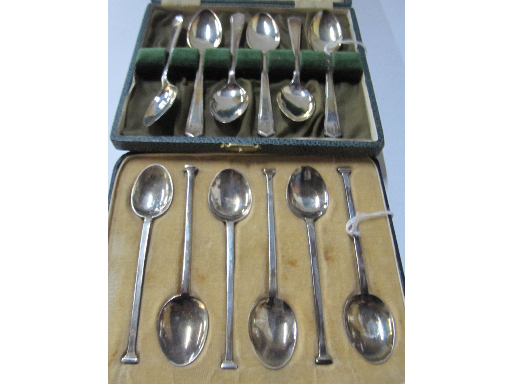 Appraisal: A lot comprising two cased sets of six silver coffee