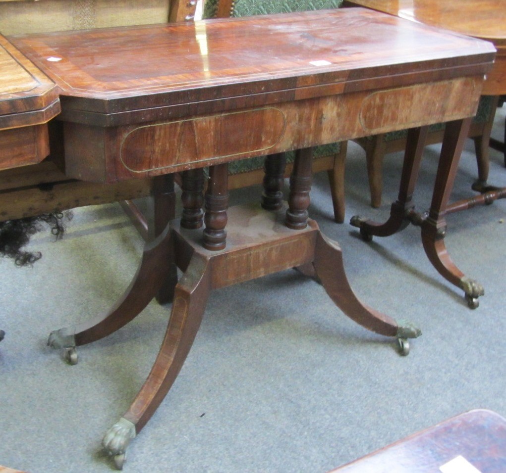 Appraisal: A George III brass inlaid rosewood and mahogany card table