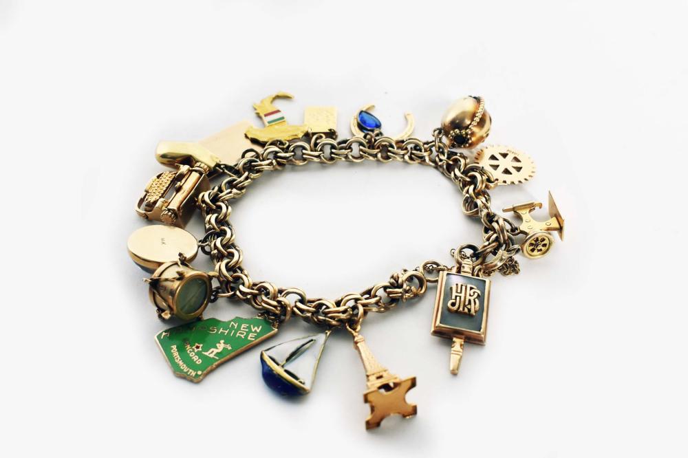 Appraisal: LADIES RETRO KT GOLD CHARM BRACELETComprising thirteen stamped kt gold