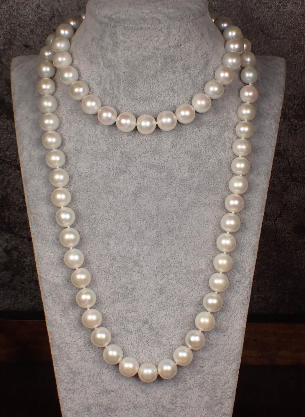 Appraisal: OPERA LENGTH WHITE PEARL NECKLACE hand-knotted strand of well matched