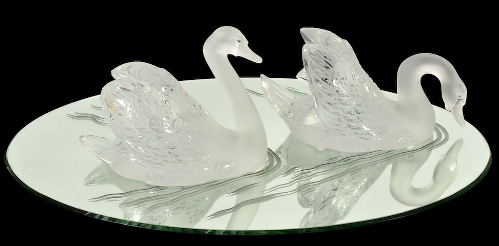 Appraisal: Two Lalique Crystal Swans on Mirror Plateau Two etched and