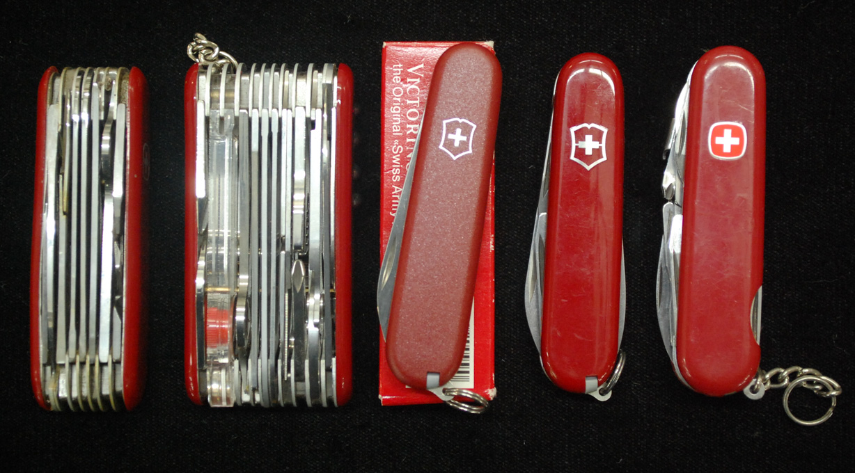 Appraisal: FIVE MULTI BLADE SWISS ARMY KNIVES Wenger eleven layer seven