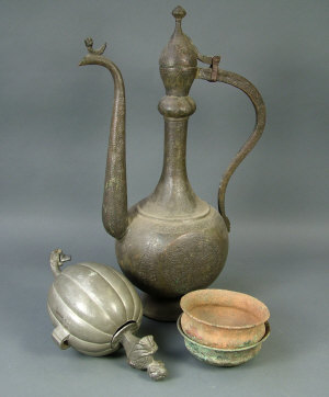 Appraisal: A Persian bronze ewer with scroll handle and domed lid