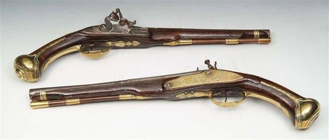 Appraisal: A PAIR OF TH CENTURY FLINTLOCK PISTOLS with walnut stocks