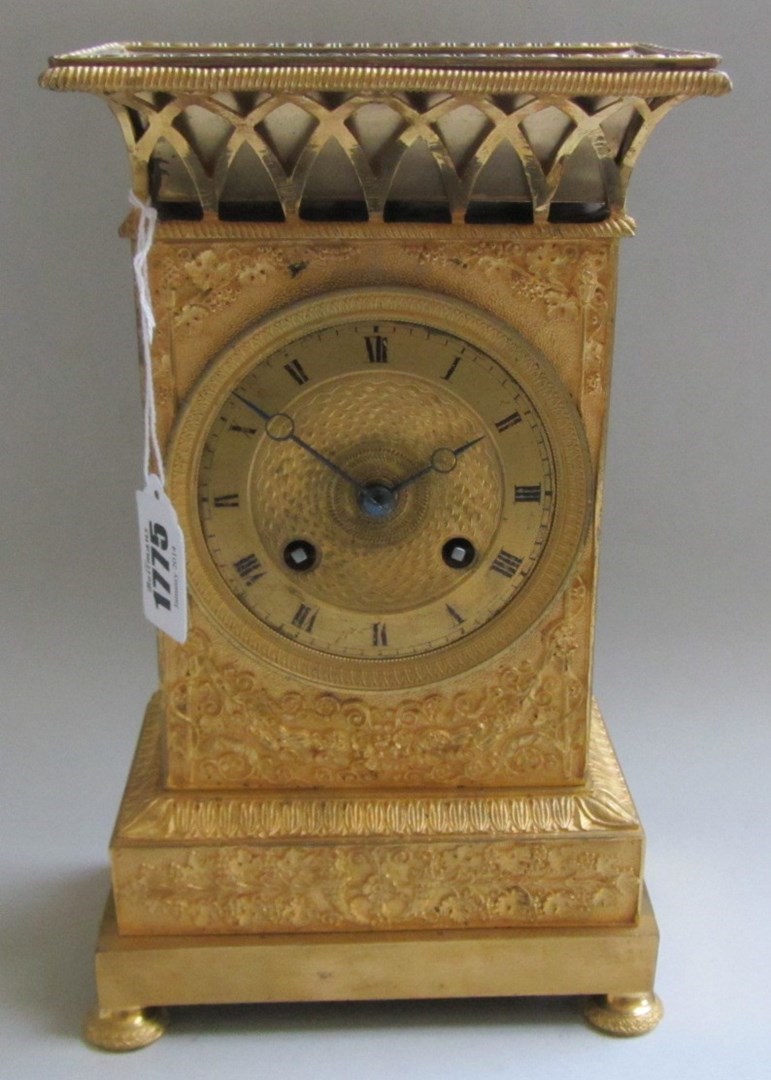 Appraisal: A continental Victorian ormolu mantel clock with pierced surmount engine