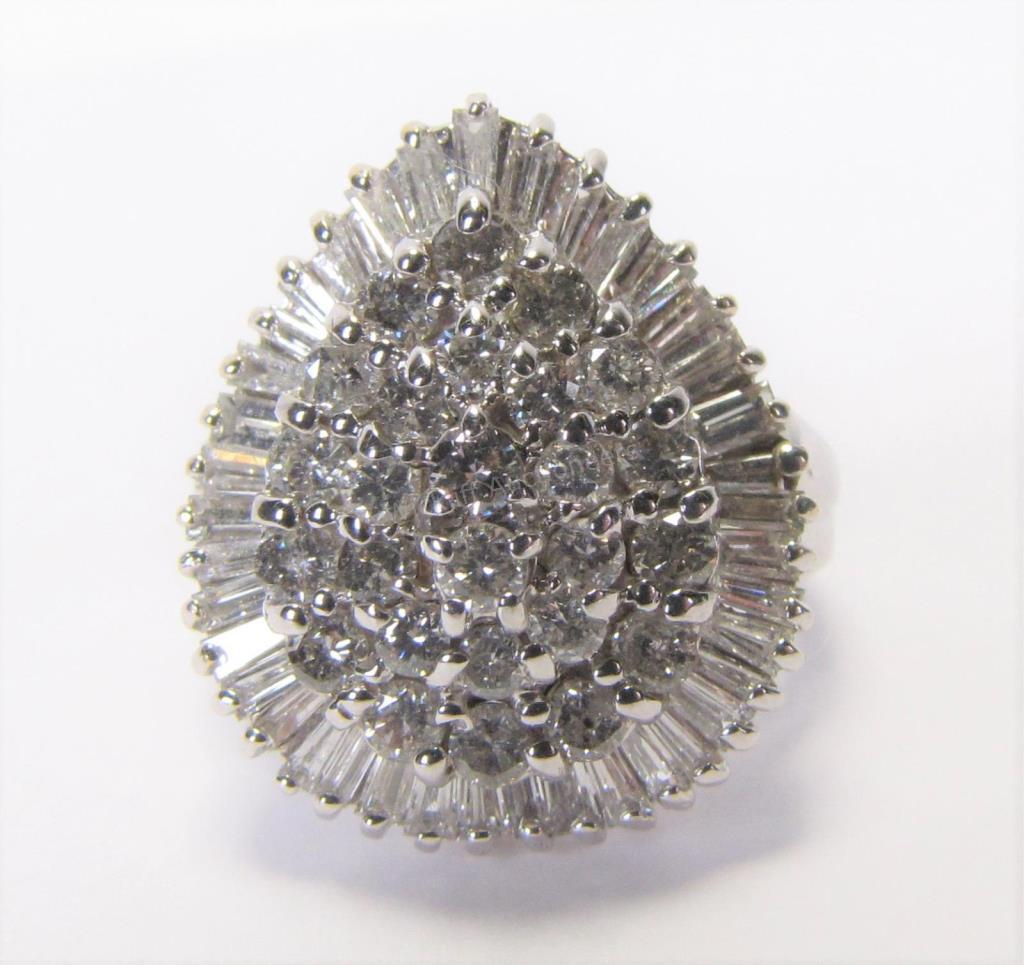 Appraisal: A K white gold pear shaped diamond cluster ring containing