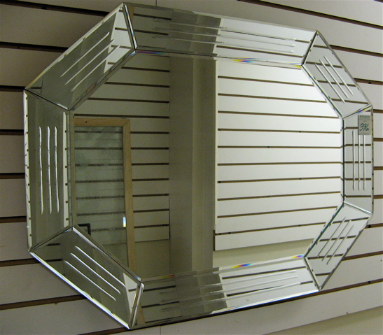 Appraisal: AN AMERICAN OCTAGONAL WALL MIRROR beveled and engraved in mirrored