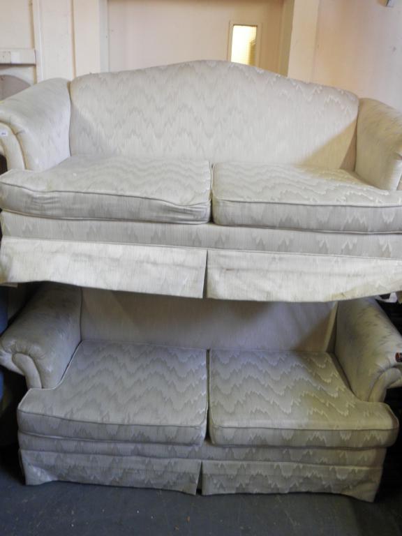 Appraisal: Two cream upholstered sofas each upholstered in 'zigzag' fabric