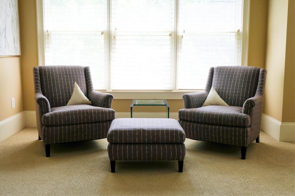 Appraisal: PAIR CONTEMPORARY CUSTOM ARMCHAIRS W OTTOMANPair of contemporary custom upholstered