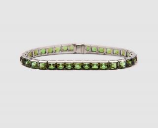 Appraisal: Platinum and Greet Tourmaline Bracelet PLATINUM AND GREEN TOURMALINE BRACELETchannel-set