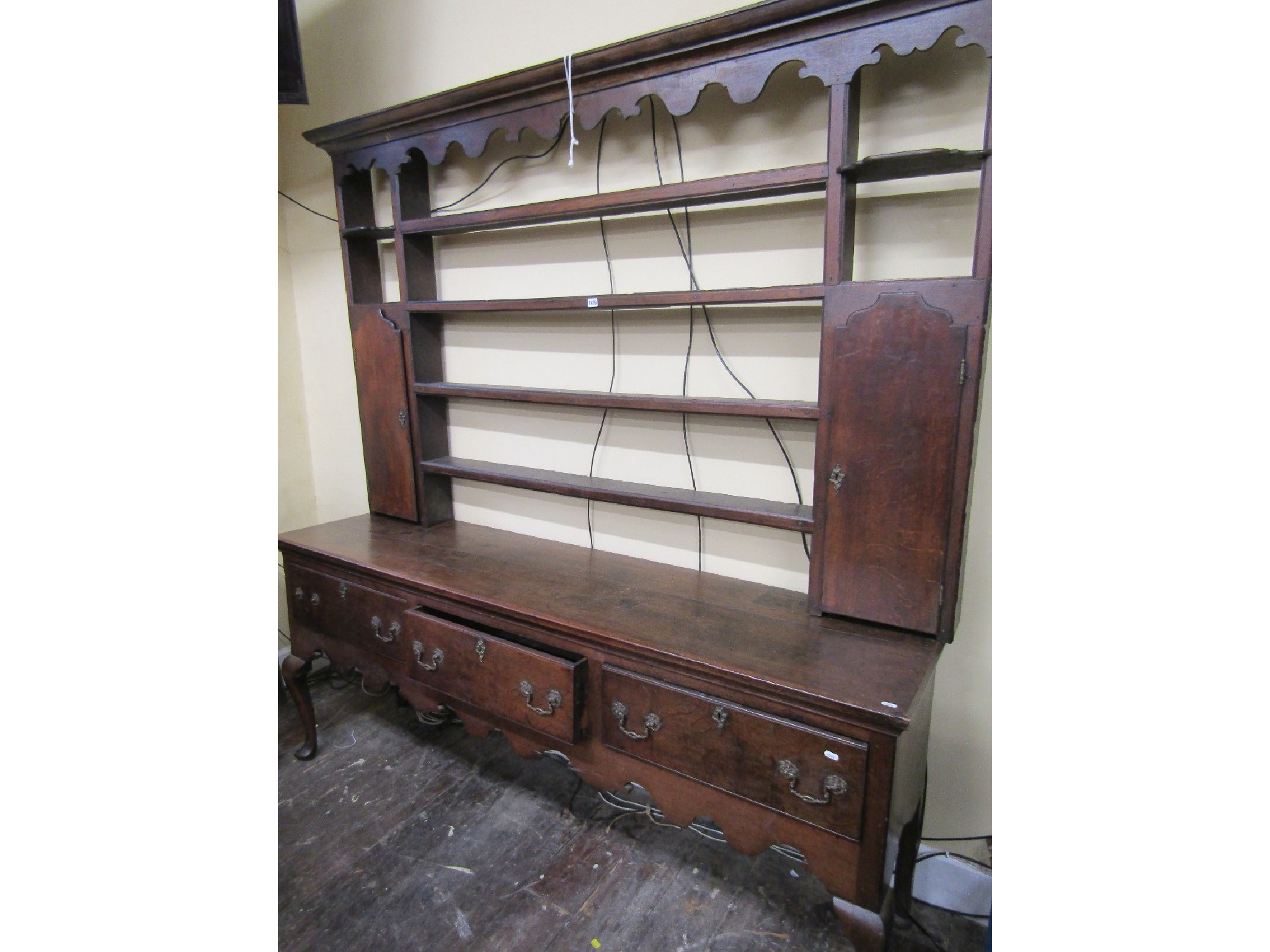 Appraisal: A George III oak dresser the base fitted with three