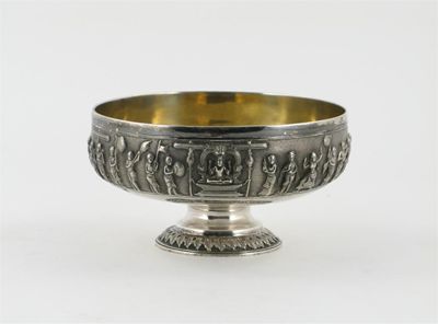 Appraisal: An Indian shallow silver bowl on a raised foot cast