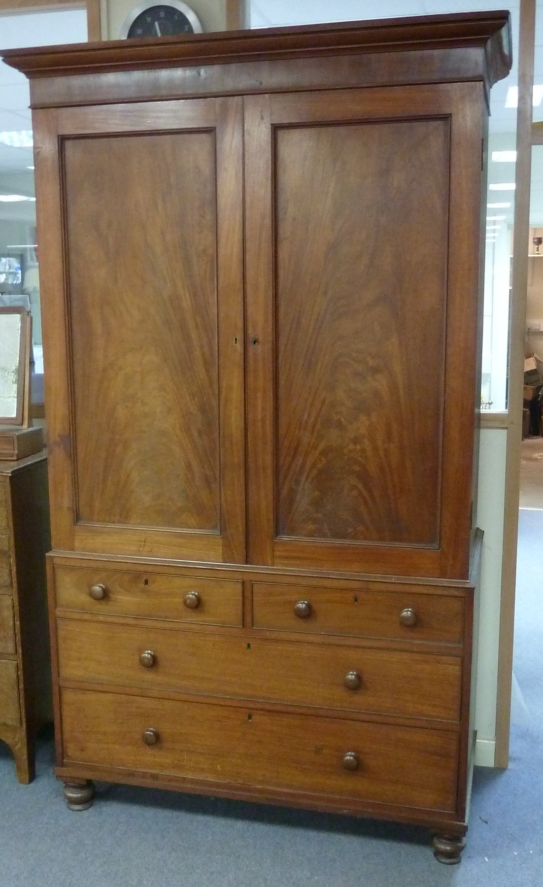 Appraisal: A William IV mahogany linen press with two panelled doors