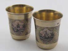 Appraisal: A pair of Russian silver vodka tots with niello decoration