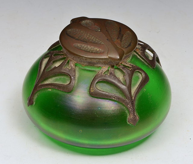 Appraisal: AN ART NOUVEAU IRIDESCENT GREEN GLASS INKWELL with pewter cover