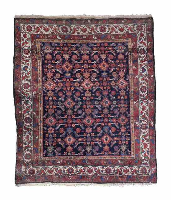 Appraisal: A Persian Wool Rug having all over stylized foliate decoration