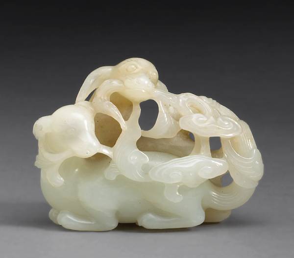 Appraisal: A white jade group of two dogs playing th th