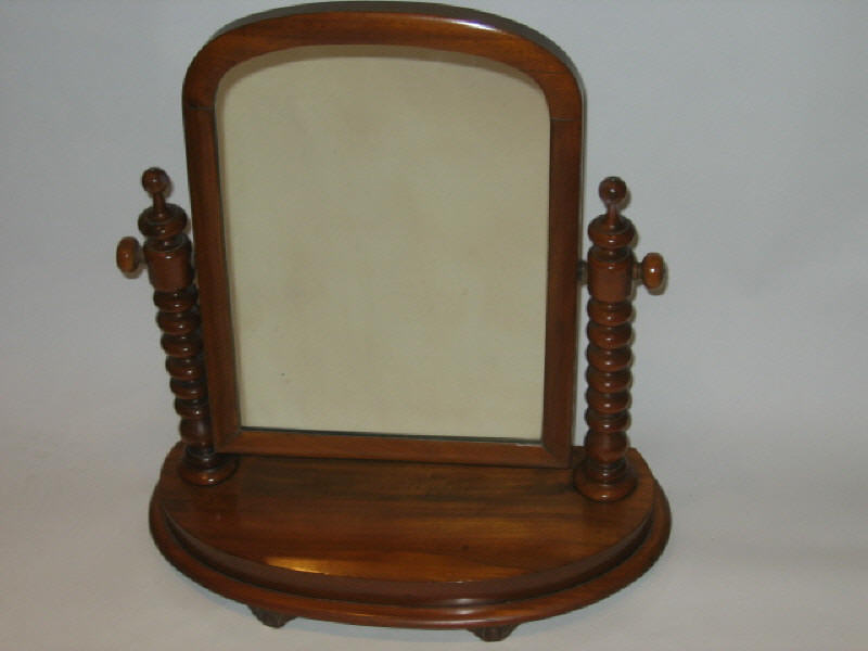 Appraisal: ENGLISH MAHOGANY VICTORIAN TOILET MIRROR The arched rectangular looking glass