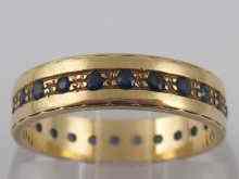 Appraisal: A carat gold sapphire set eternity ring size ''O''