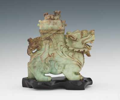 Appraisal: Jade Monster Vessel with Small Monster on Lid Jade carved