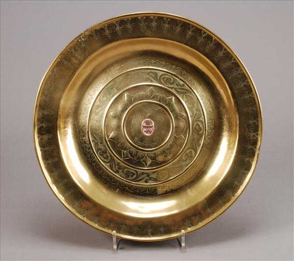 Appraisal: A Nuremberg brass alms dish late th century with inset