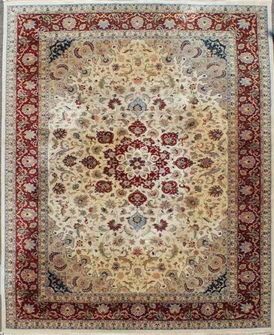 Appraisal: An Oriental Kashan design carpet with field of scrolling foliage