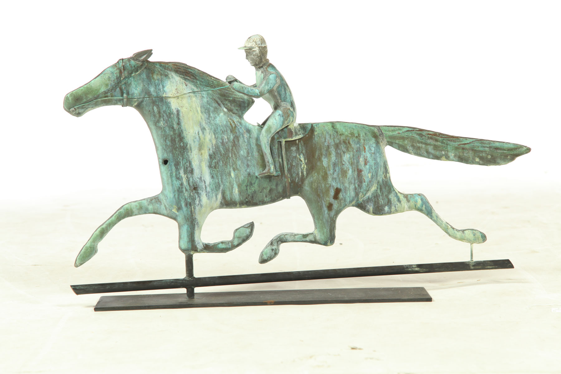 Appraisal: WEATHERVANE American late th century copper Jockey on running horse