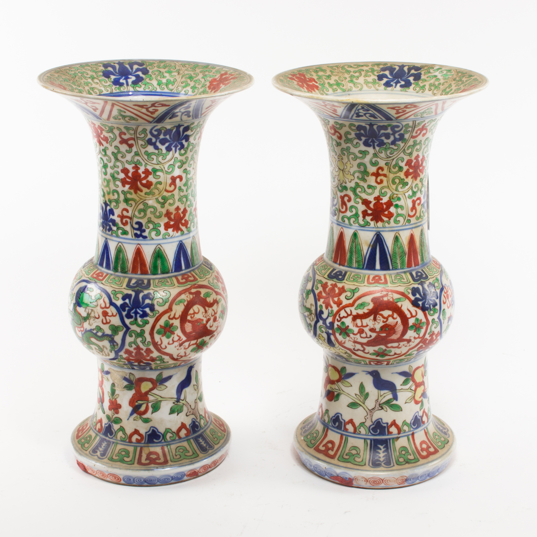 Appraisal: PAIR OF WUCAI GLAZED 'DRAGON' GU-FORM VASES Pair of wucai