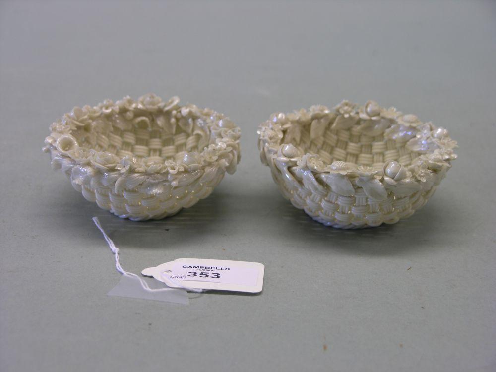 Appraisal: A pair of Belleek style pots encrusted with foliage in