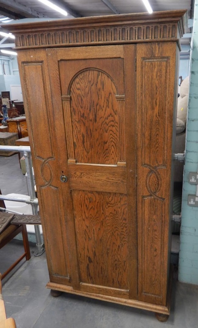 Appraisal: A 's oak hall type wardrobe with a panelled door