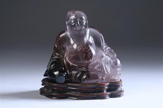 Appraisal: CHINESE ROCK CRYSTAL FIGURE OF MAN Seated with wood stand