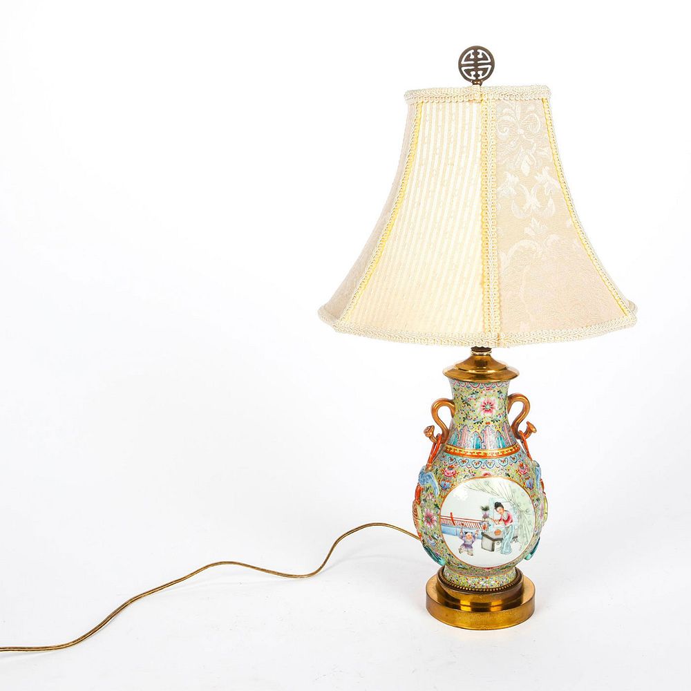 Appraisal: CHINESE CELADON FAMILLE ROSE PORCELAIN TABLE LAMP Richly decorated floral