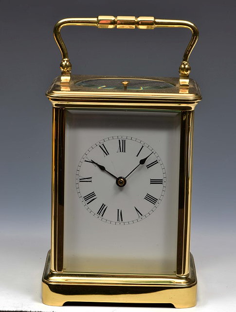 Appraisal: A FRENCH CARRIAGE CLOCK with white enamel Roman dial eight