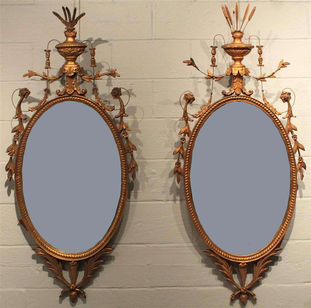 Appraisal: PAIR OF NEO CLASSICAL STYLE CARVED GILTWOOD MIRRORS each having