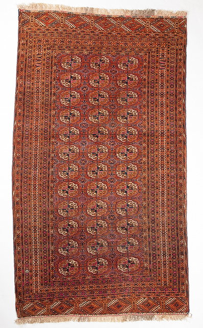 Appraisal: A TEKKE TURKOMAN RUG decorated three rows of guls within