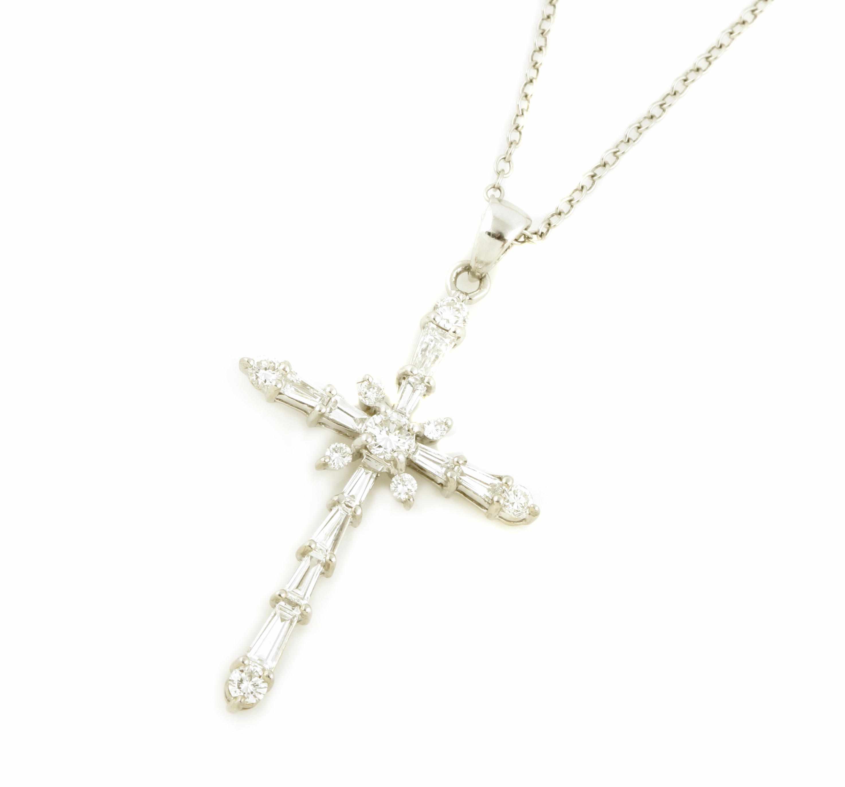 Appraisal: A diamond and platinum cruciform pendant with chain pendant dimensions