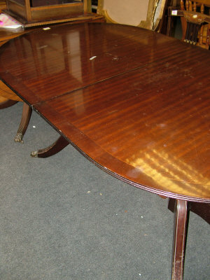 Appraisal: A mahogany dining table th century the rounded top above