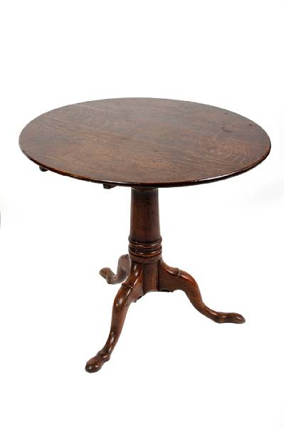 Appraisal: A George III oak tilt top occasional table height in