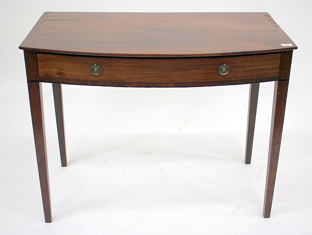 Appraisal: A GEORGIAN MAHOGANY BOW FRONTED SIDE TABLE with single frieze