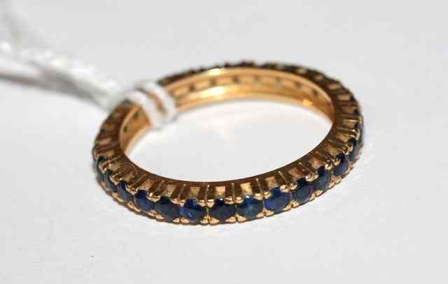 Appraisal: A SAPPHIRE SET FULL ETERNITY RING SET with claws