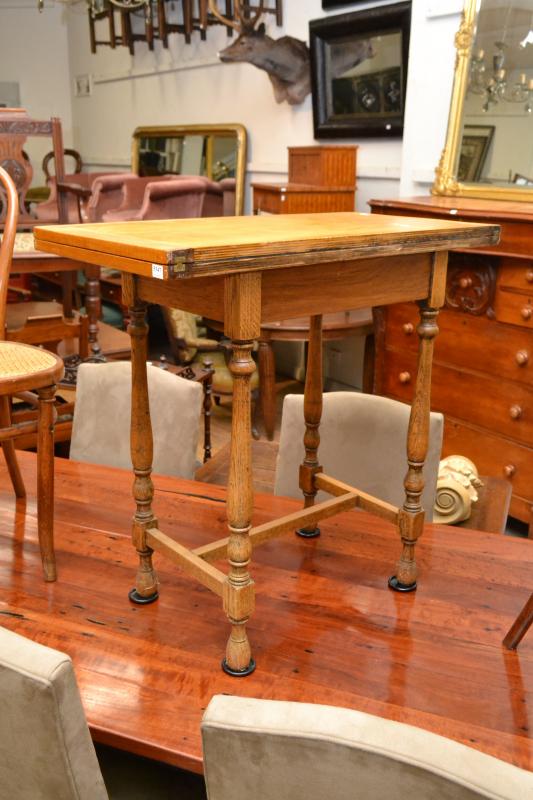 Appraisal: AN OAK JACOBEAN STYLE FLIP TOP TABLE AN OAK JACOBEAN