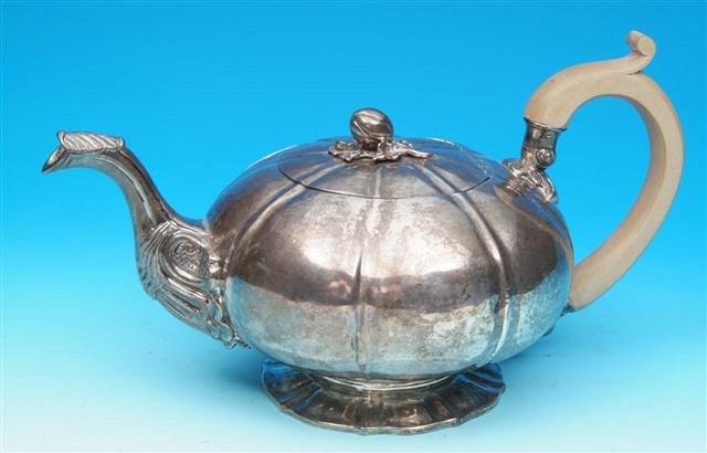 Appraisal: A George IV silver teapot of melon form the flush