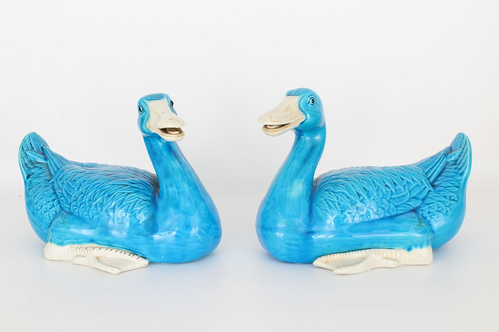 Appraisal: Pair of Blue White Glazed Seated Ducks Sizes x in