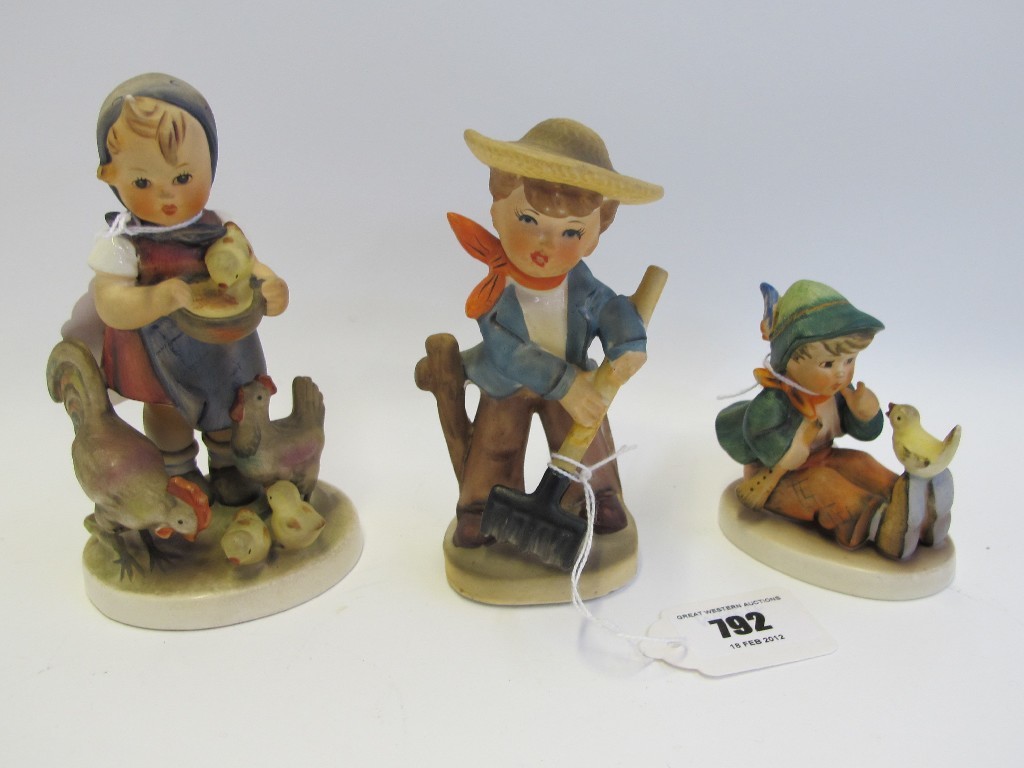 Appraisal: Two Hummel figures 'Singing Lessons' and 'Feeding Time' and one