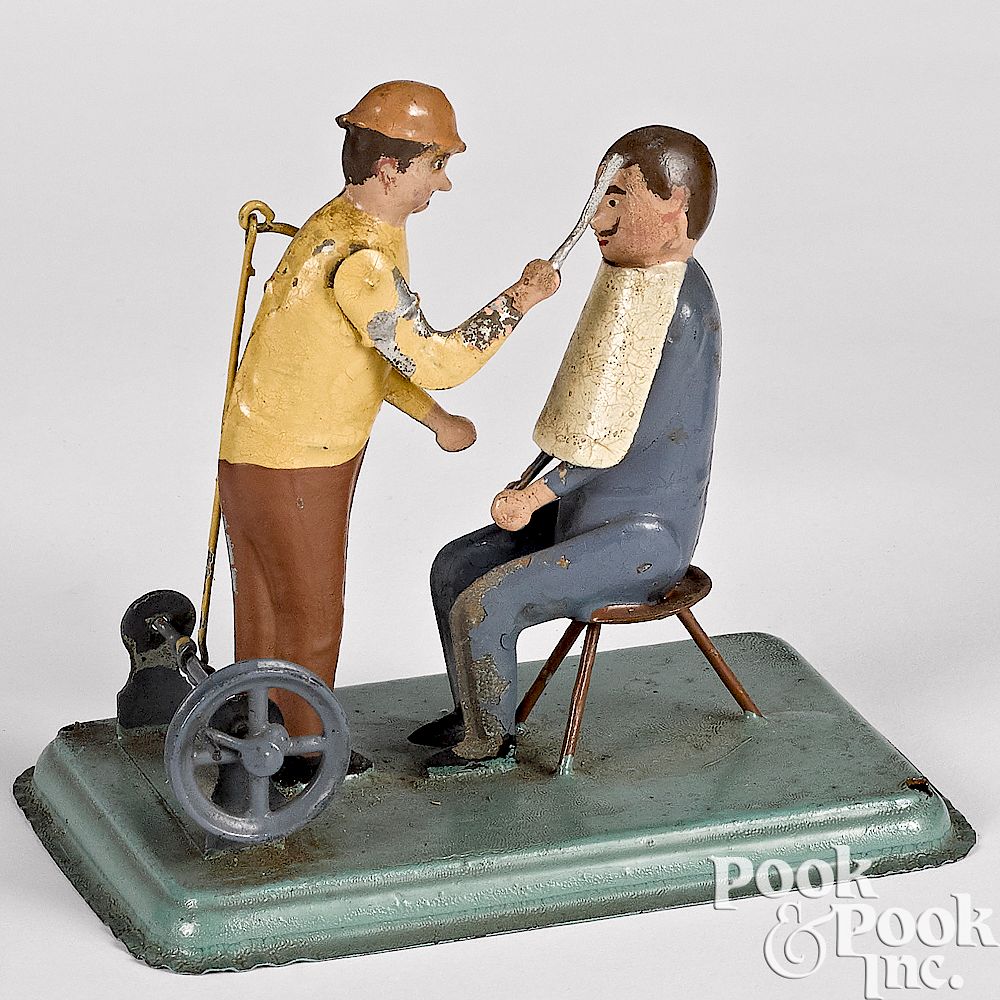 Appraisal: Painted tin barber steam toy accessory Unusual painted tin barber