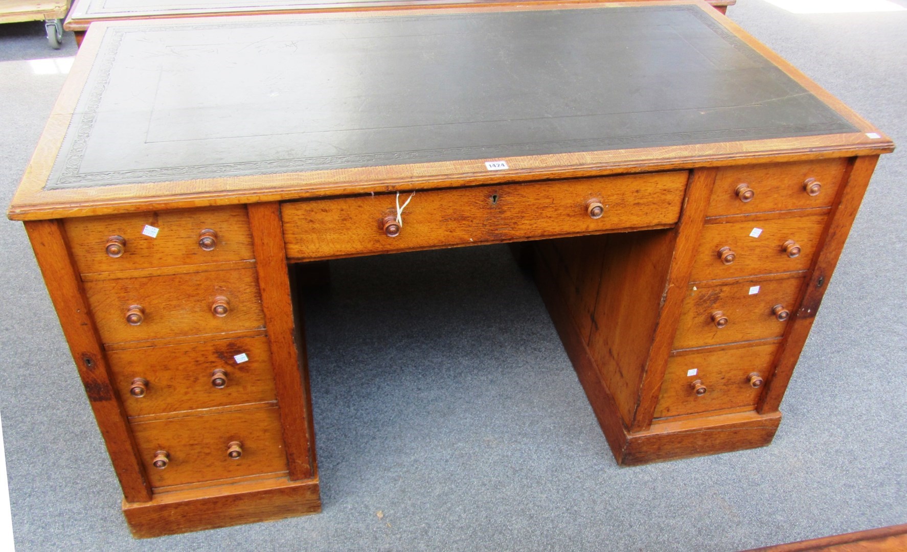 Appraisal: A th century oak writing desk with nine drawers about