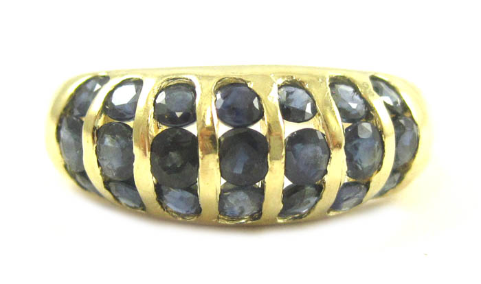 Appraisal: SAPPHIRE AND FOURTEEN KARAT GOLD RING set with round-cut sapphires