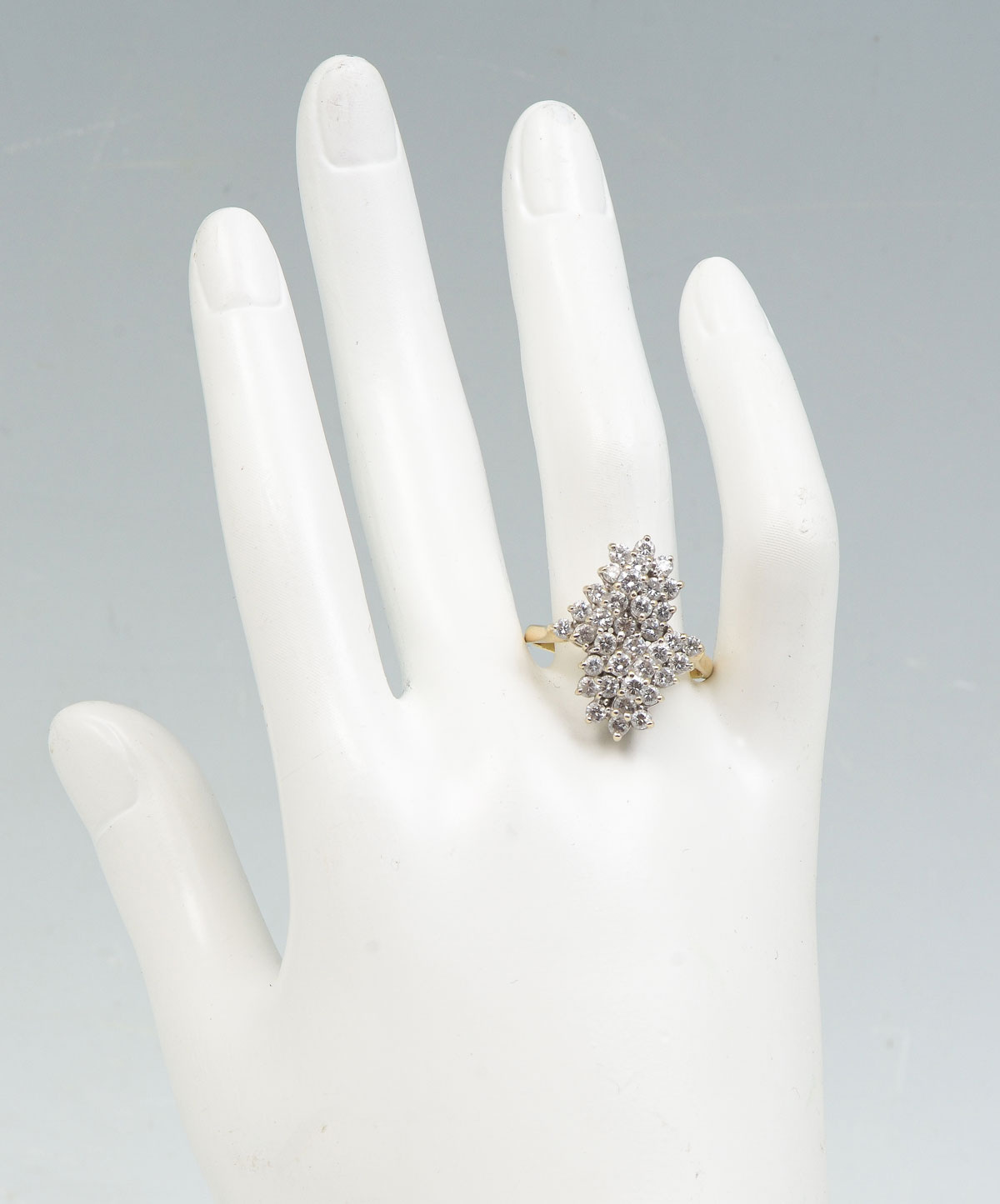 Appraisal: K DIAMOND DINNER RING K yellow gold ring contains round