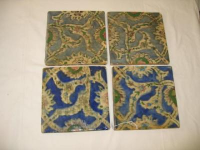 Appraisal: A SET OF FOUR ISNIK TILES painted with foliate banding