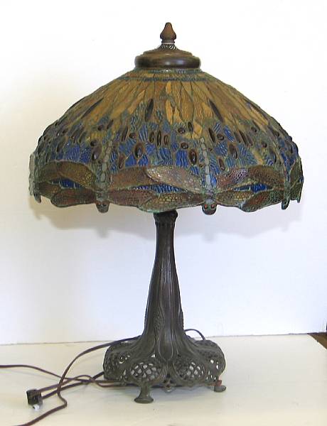 Appraisal: A Tiffany style leaded glass and patinated bronze dragonfly motif